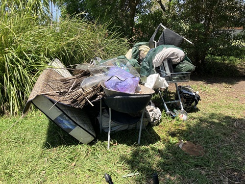 Pile of rubbish in green space